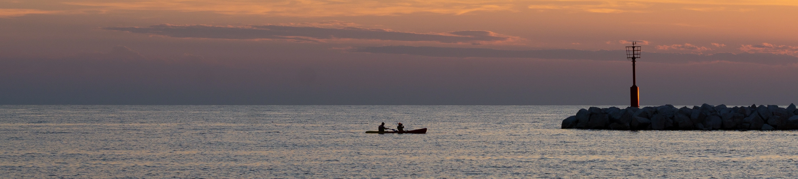 boat at the sea at sunset